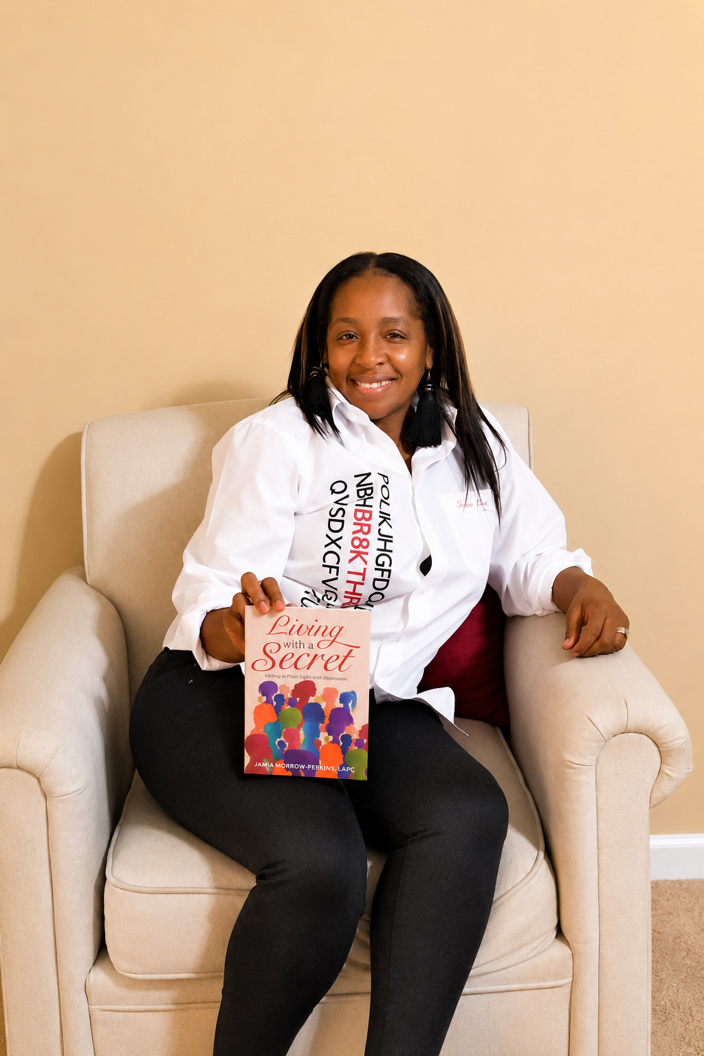 Jamia Morrow holding her book Living With a Secret